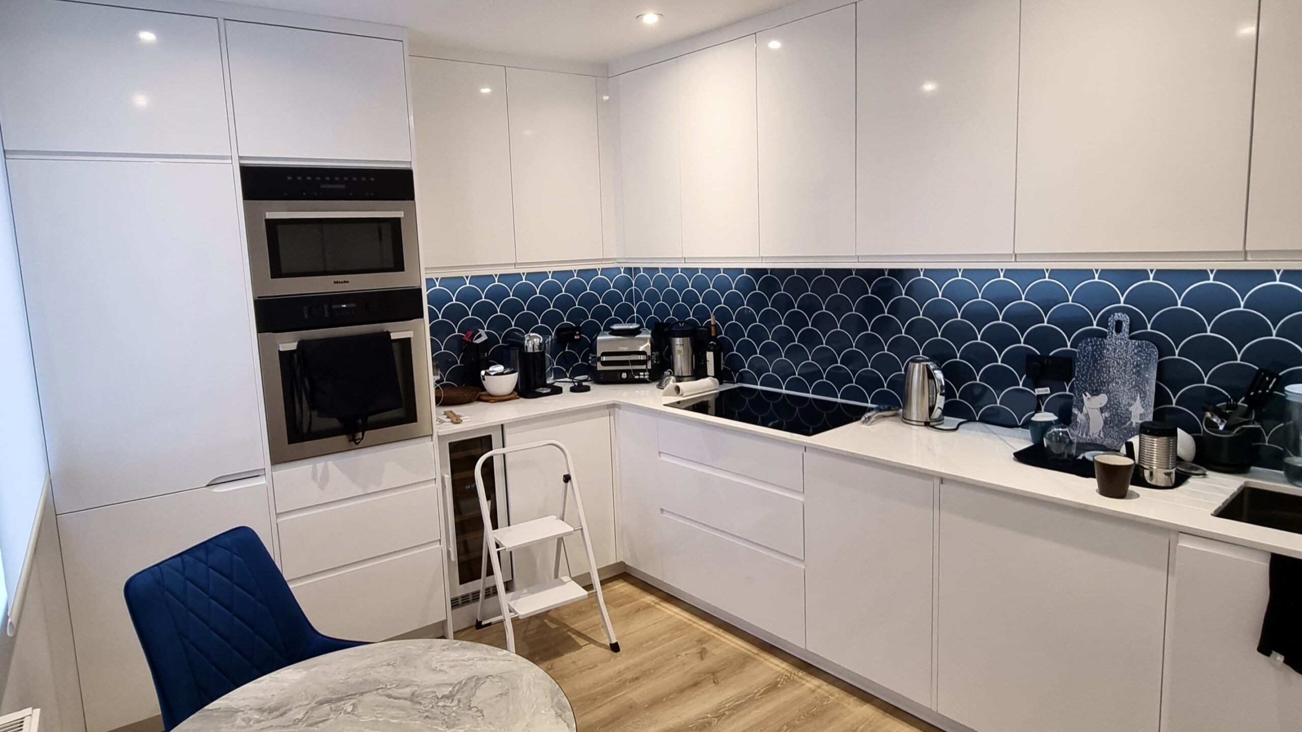 Modern White Kitchen with Blue Accent